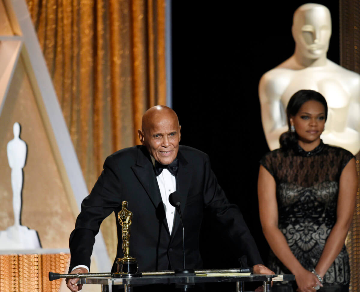 Honoree singer and social activist Harry Belafonte speaks after receiving the Oscar statuette for the Jean Hersholt Humanitarian Award, at the Academy of Motion Picture Arts and Sciences Governors Awards in Los Angeles