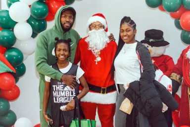 Santa with parents and their daughter.  Michelle Gibbs/WIADCA