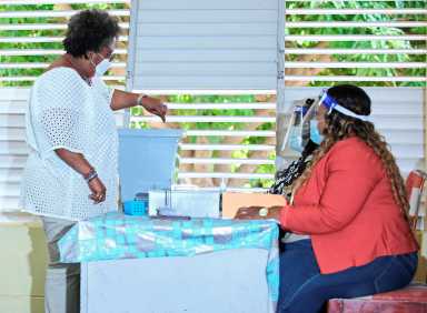 Barbados Prime Minister Mia Mottley casts her ballot to vote in St Michael