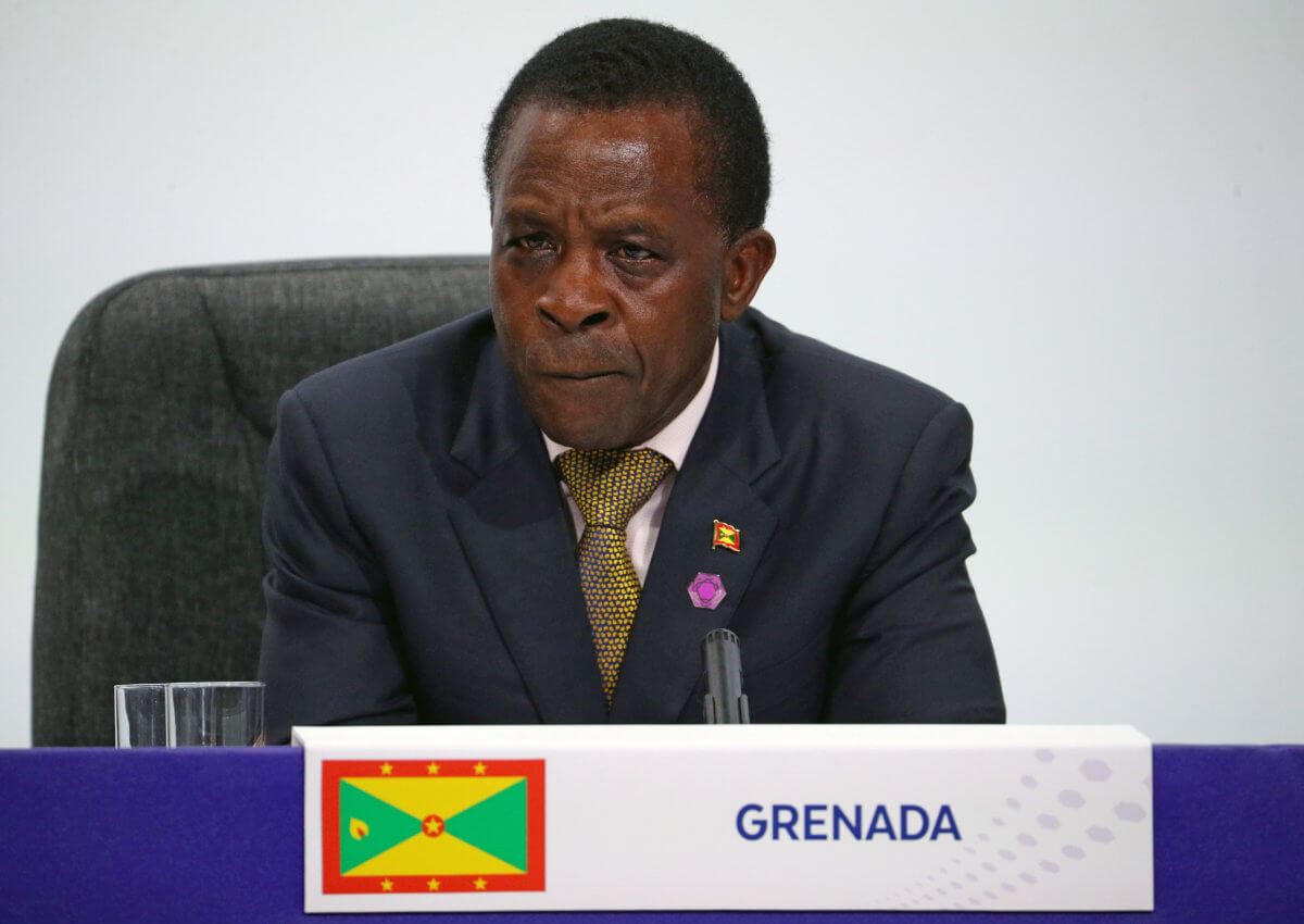 Grenada’s Prime Minister Keith Mitchell listens during a news conference to mark the end of the Commonwealth Heads of Government Meeting at Marlborough House in London
