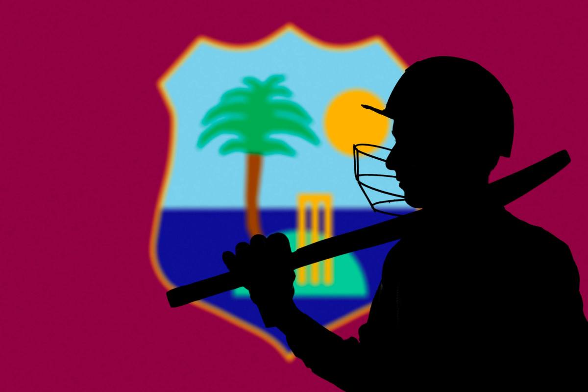 Cricketer silhouette on West Indies blurred flag background
