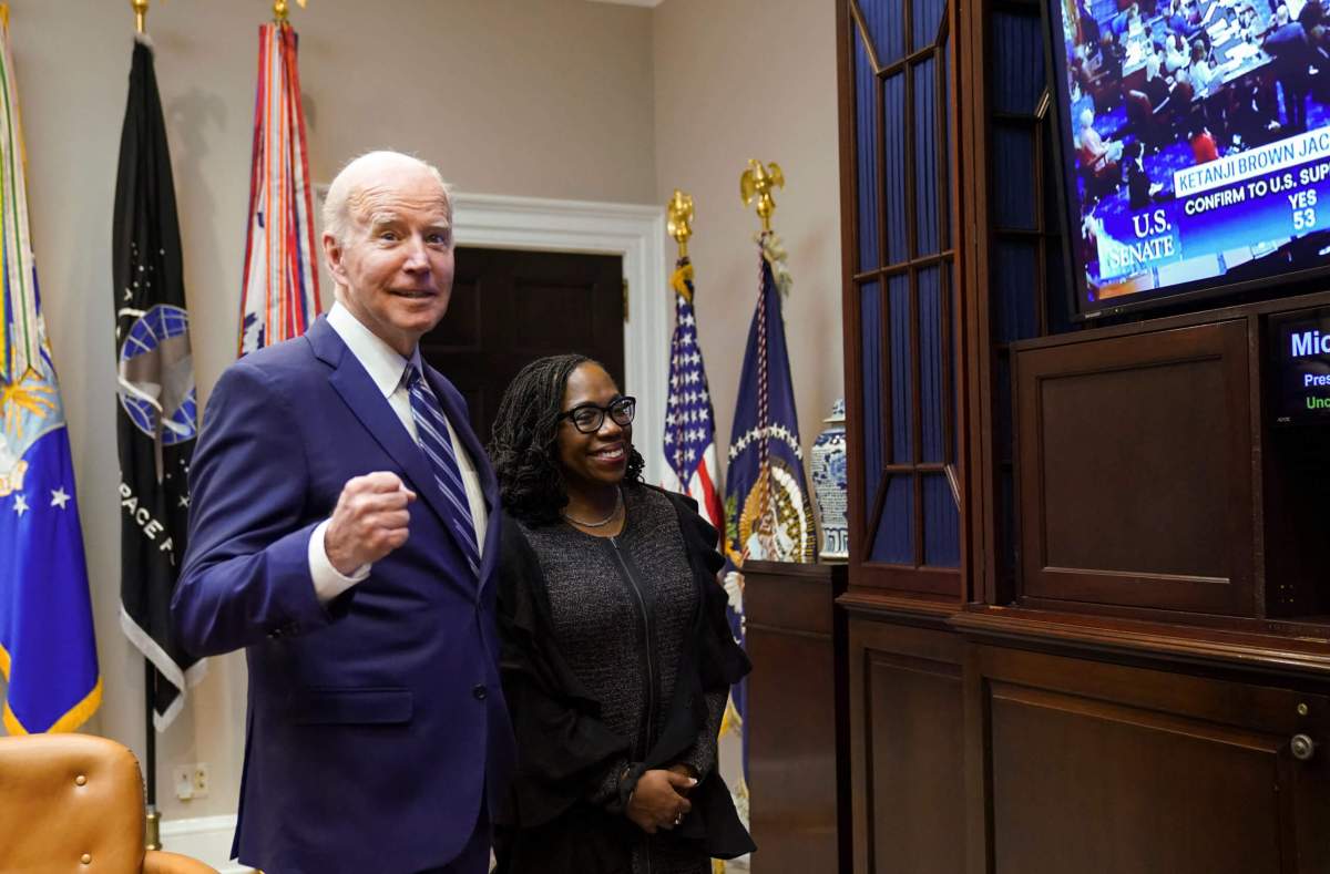 U.S. President Joe Biden and Supreme Court nominee Judge Ketanji Brown Jackson watch as the full U.S. Senate votes to confirm Jackson as the first Black woman to serve on the U.S. Supreme Court, from the Roosevelt Room at the White House in Washington, U.S., April 7, 2022.