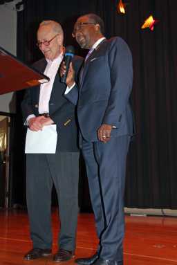 Nick Perry and Sen. Schumer converse on stage. Photo by Nelson A. King