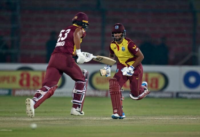 West Indies Nicholas Pooran, right, Brandon King run between the wickets during the second Twenty20 international cricket match between Pakistan and West Indies at the National Stadium, in Karachi, Pakistan, Tuesday, Dec. 14, 2021. 