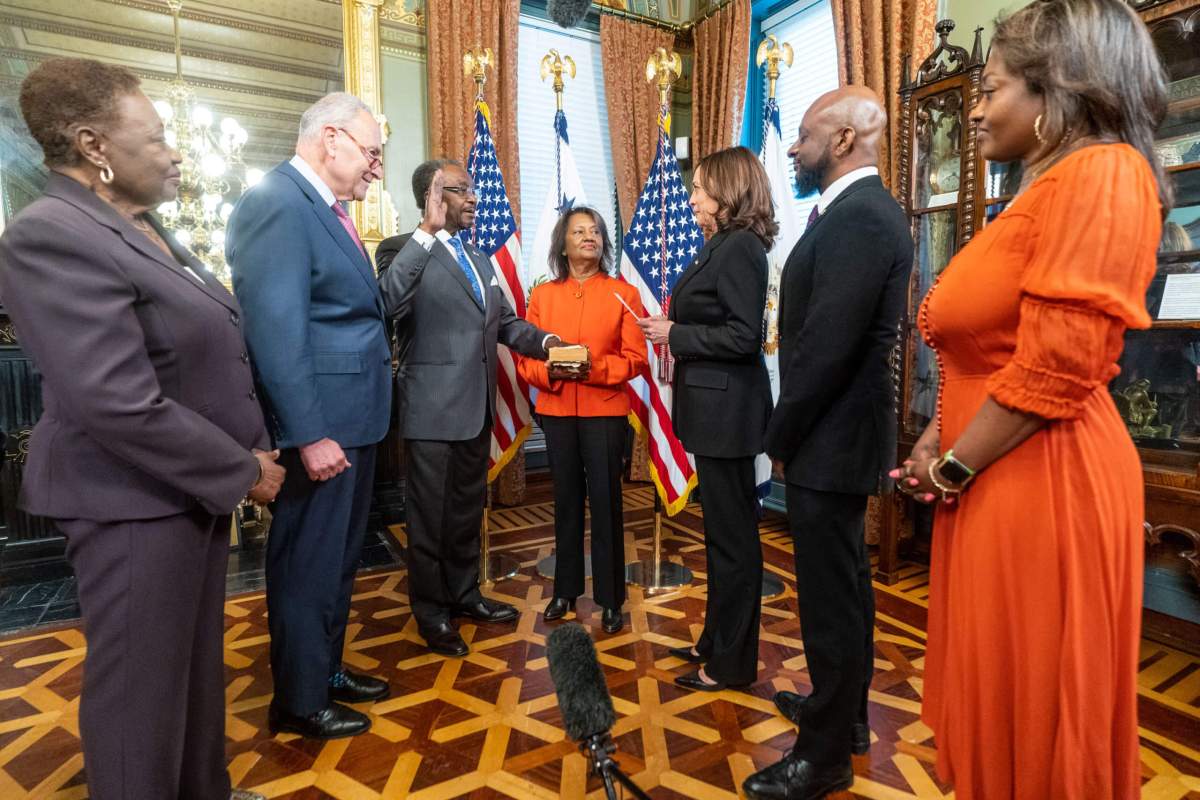 Vice President Kamala Harris administers the oath of office for U.S. Ambassador to Jamaica N. Nick Perry, Monday, May 9, 2022, in the Vice President’s Ceremonial Office in the Eisenhower Executive Office Building at the White House. The Ambassador’s wife Joyce Perry holds the family bible during the swearing-in. From left: Perry's sister, Pauline Perry; Sen. Charles "Chuck" Schumer; Amb. Nick Perry; Perry's wife, Joyce; Vice President Kamala Harris; the Perry's son, Nickolas, and daughter, Novalie.