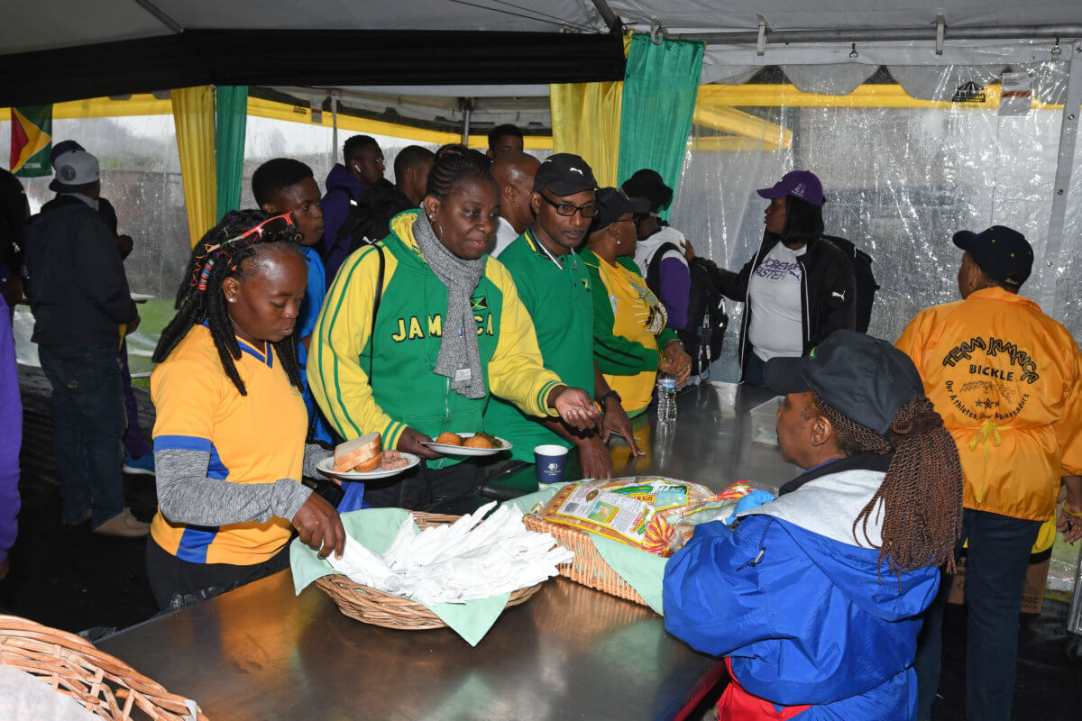 Jamaican athletes get meal at Team Jamaica Bickle Tent.  Team Jamaica Bickle
