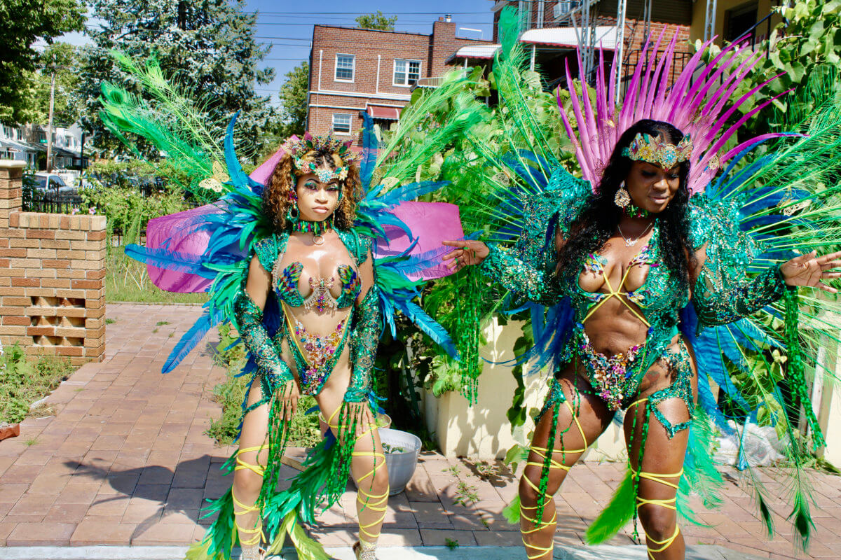 Masquerader, Kayla Freeman, left, and Suga Candy Mas band leader Maxine Magdaleno, showcase creations from the Ambrosia section designed by Carib Colors, as part of an exciting costume band, ready to vie in the 'big band' category on Labor Day, Monday, Sept. 5.