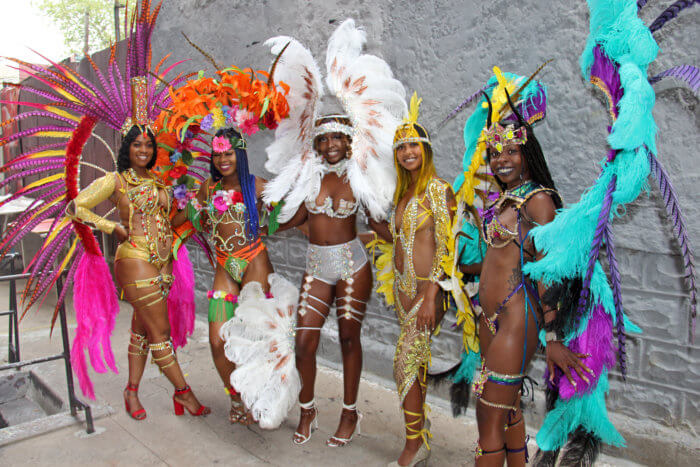 Masqueraders in Antoine International. From left Cassandra Nicholas portrays Ultra Carnival (Trinidad), Alissa Victor portrays 'Jewel Box,' Shaniya Ramjattan portrays 'Rekindle,' and Akiya Can portrays 'Bermuda Triangle.'