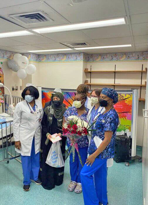 Baby Raneem Almohana's medical team poses with her mother before her departure from Brookdale. 