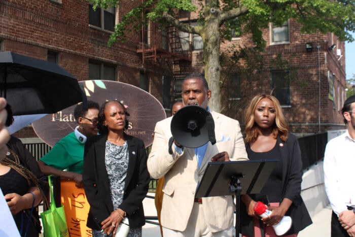 Assemblymember Monique Chandler-Waterman, NYS Sen. Kevin Parker, and Councilmember Farah N. Louis, surrounded by protesters, demanding change at Flatbush Gardens in Brooklyn.