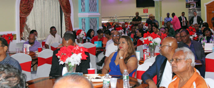 Compatriots listen with rapt attention, as Vice-President of Guyana Bharrat Jagdeo outlines initiatives his government put in place to address inflation, while speaking on Guyana's development at a Meet & Greet at Royal Empress Hall, in South Ozone Park, Queens.