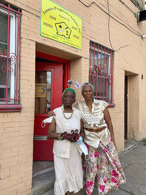 Vena W. Baker and Sadie Campbell, president of JPL pose outside the Jamaica Progressive League, inc. office in the Bronx. 