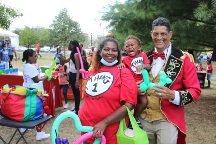 The little one and his parent meet Ding-A-Ling, the clown, at the annual fun day in Canarsie Park, Brooklyn.