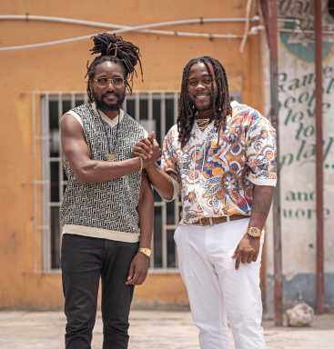 Kabaka Pyramid, left, pose with Jemere Morgan, son of Gramps Morgan.