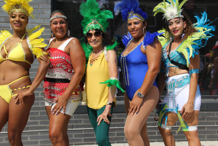 Masqueraders from the Hispanic contingent.