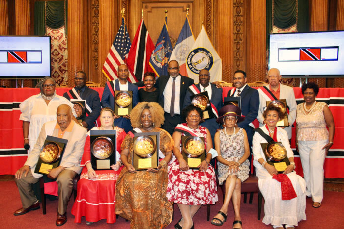 Pictured, back row standing Ð Angela Cooper, CEO/founder of the Coral Reef Experience, Gary Alexander Pierre, Kurt Bartholomew, Deputy Borough President, Diana Richardson, T&T Consul General Andre Laveau, Honorees, Carlston Gray, Daniel L. Beckles MD, PhD, and Kenrick Faustin, and Yolanda Lezama-Clark, president, Lezama Archives & Caribbean Cultural Center, Inc. Sitting, honorees Michael YoungLao, Janet E. Larghi, MPA, CTRS, Valerie McLeod-Katz, Lynette Richardson, Dr. Una Clarke, and honoree, Jean Alexander.