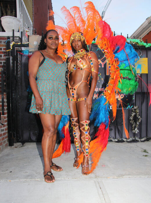 Grenadian-born Ermine Paul with masquerader Jassmin Yalley, of Ghana, as she portrays "Sunset Treasure."