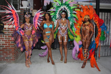 Masqueraders in "Hidden Treasures." From left: Dalila Pantaleon, of Trinidad and Tobago, portrays "Ameythst Goddess," Mischa Clarke, of Jamaica, portrays "Lapis Lazuli," Shanice Darville, of St. Lucia, portrays "Garden of Eden" and Jassmin Yalley, of Ghana, as she portrays "Sunset Treasure."
