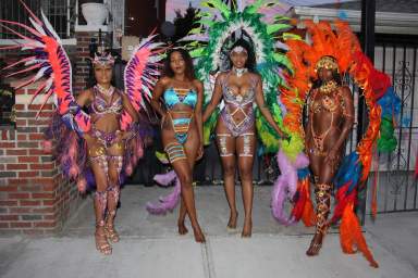 Masqueraders in "Hidden Treasures." From left: Dalila Pantaleon, of Trinidad and Tobago, portrays "Ameythst Goddess," Mischa Clarke, of Jamaica, portrays "Lapis Lazuli," Shanice Darville, of St. Lucia, portrays "Garden of Eden" and Jassmin Yalley, of Ghana, as she portrays "Sunset Treasure."