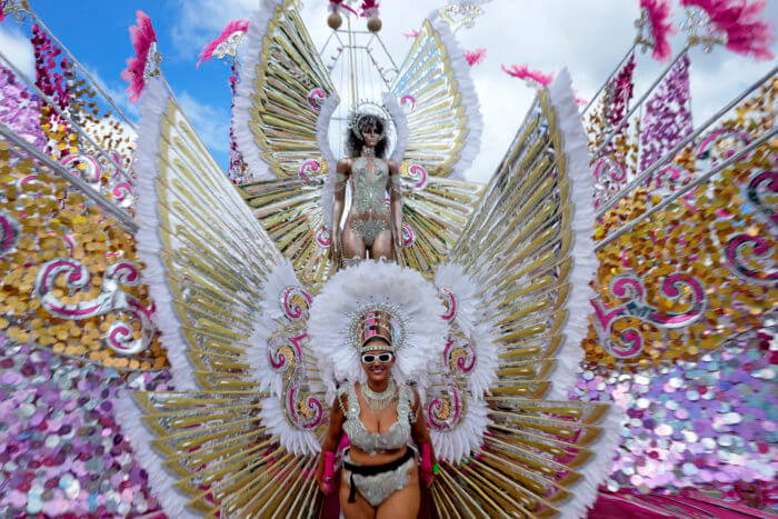 A masquerader performs during the Caribbean Carnival parade in Toronto, Canada, Saturday, July 30, 2022.