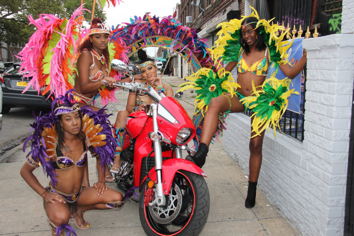 Models in Branches and Associates' band "Carnival is Color. From left: Shantel Chambers portrays 'Power, Strength and Royalty,' Selena Thorman portrays 'Seduction,' Teshanna Thorman portrays 'Colors of the Band; and Kathline St. Fleur portrays 'Sunset.'