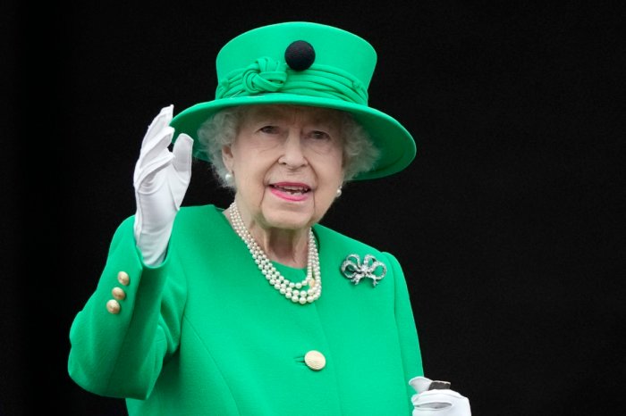 FILE - Queen Elizabeth II waves to the crowd during the Platinum Jubilee Pageant at the Buckingham Palace in London, Sunday, June 5, 2022.