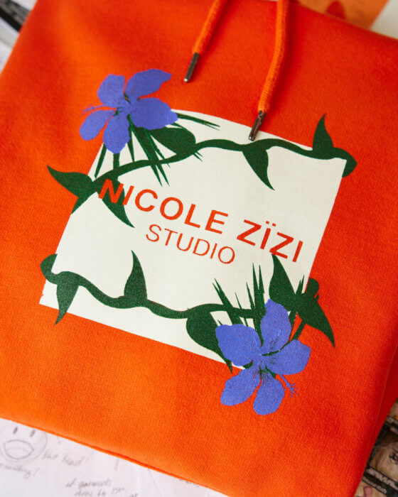 'Solaris Orange Hoodie' by designer Nicole Zizi. 