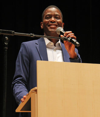 Grenada PM Dickon Mitchell addresses town hall at Brooklyn College on Sunday, Sept. 18, 2022.