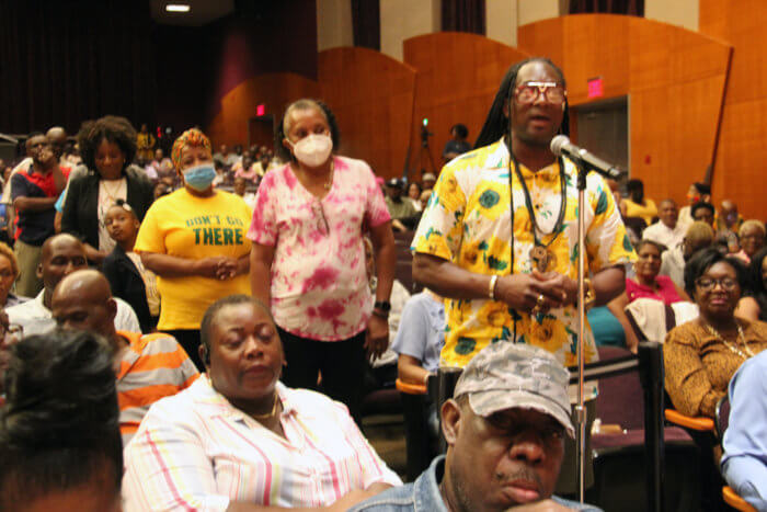 Grenadian nationals queue for questions and answers at the town hall meeting at Brooklyn College. 