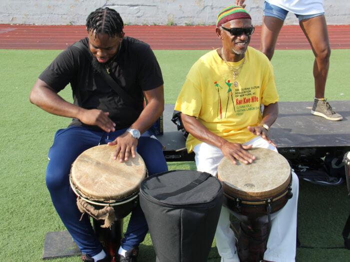Drumming: Winston "Jeggae" Hoppie, with turban, in yellow T-shirt, and Ato Greene.