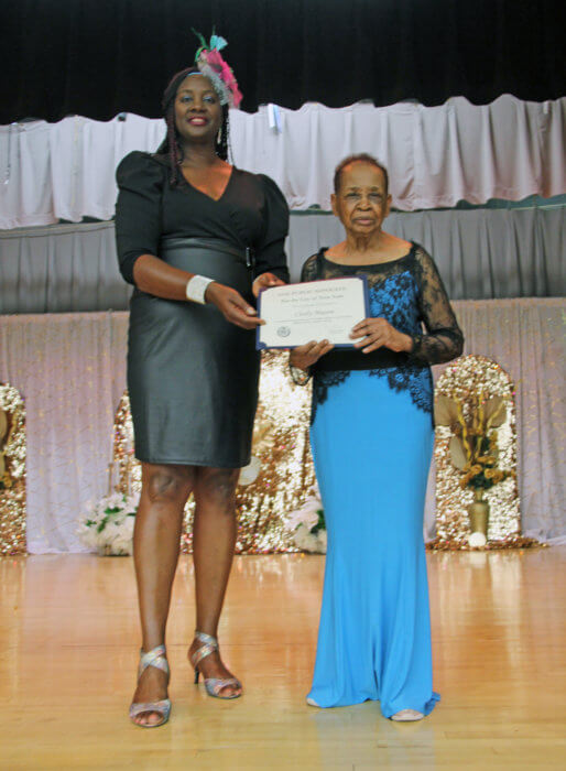 Jennifer Viechweg-Horsford (left), on behalf of NYC Public Advocate Jumaane Williams, presented a certificate to pageant organizer, Cecily Mason.