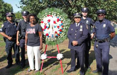 Dr. Judith Newton, third from left, with officers from the 69th Precinct.