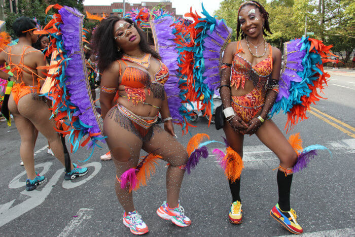 Haitian Tameka A, left, and African American Melody play with Branches and Associates.