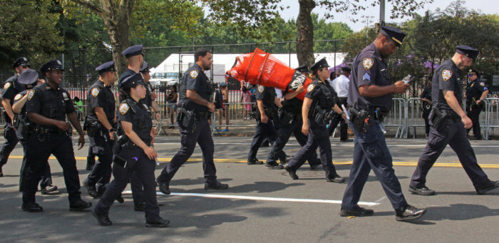 Cops march to the parade route.