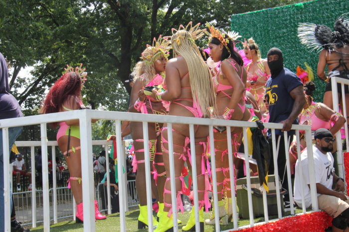 Masqueraders on Sesame Flyers float.