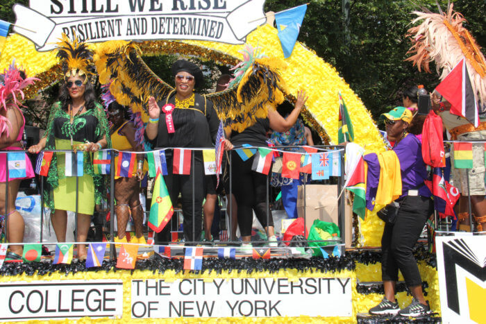 Medgar Evers College float with President Dr. Patricia Ramsey, right, in black, and Dr. Evelyn Castro to her left.