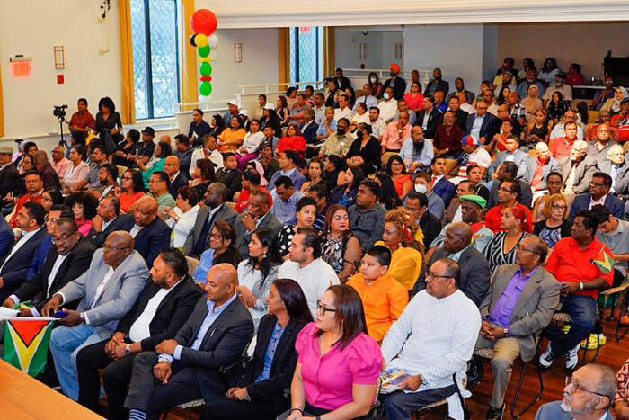 A packed audience listened to President Irfaan Ali during his address to push his "One Guyana initiative" as an interfaith forum at JPAC, Queens on Sept. 18. 