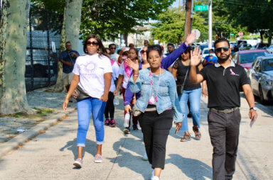 Allison Alexis with District Leader Richard S. David front, followed by supporters and survivors, as they circle Smokey Park at the 7th Annual Queens Cancer Walk on Sept. 17.