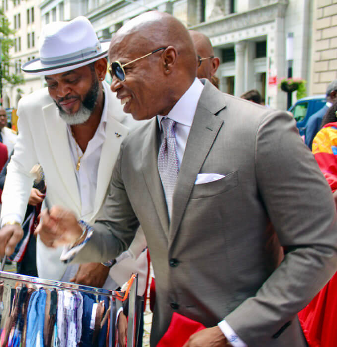 Mayor of the City of New York Eric L. Adams, gets a taste of the steelpan from energetic pannist Dale Gulston at the T&T Golden Jubilee flag raising ceremony at Bowling Green in NYC. 