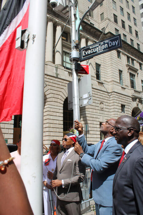 Mayor Eric L. Adams, CG J. Andre Laveau, and Ambassador to the US Anthony Phillips Spencer raise the T&T flat to commemorate the Republic's Golden Jubilee, at Bowling Green in NYC. 