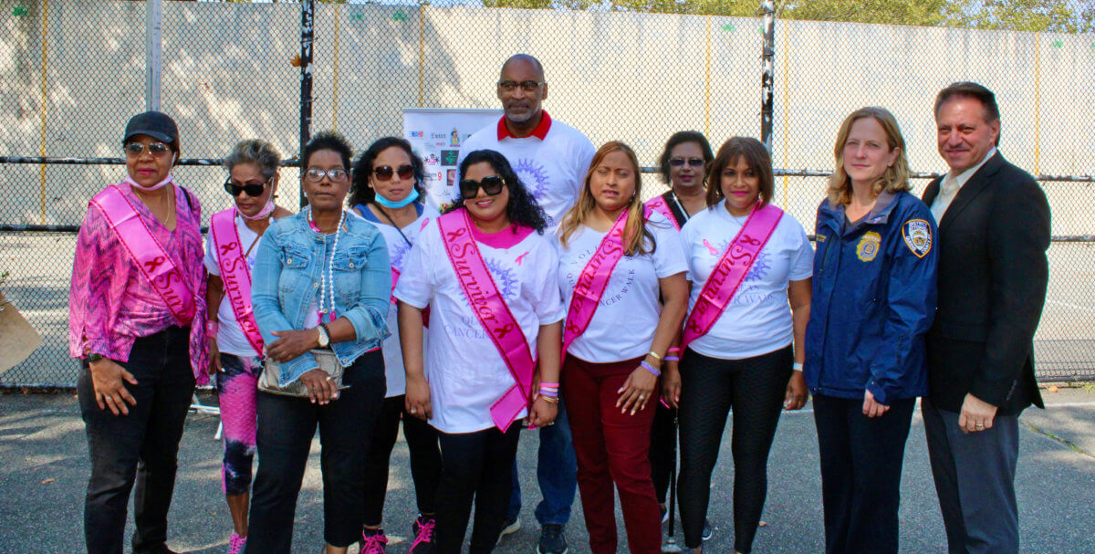 Allison Alexis (third from left) surrounded by cancer survivors, Council General of Trinidad & Tobago in New York, J. Andre Laveau (back row), Queens District Attorney Melinda Katz (ninth) (front row) and NYS Senator Joseph P. Addabbo at the recently held 7th Annual Queens Cancer Walk in Smokey Park.
