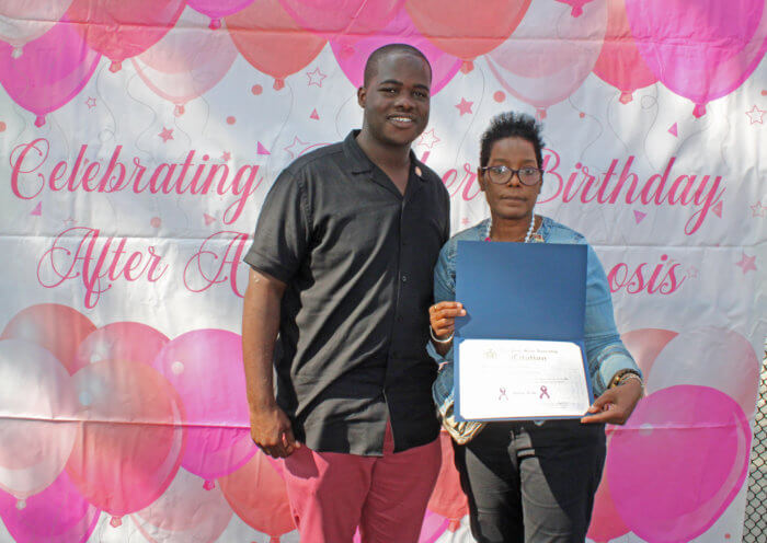 Assembly Member Khaleel Anderson presents Allison Alexis with a Citation at the recently held 7th Annual Queens Cancer walk in Smokey Park.