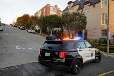 A police car blocks the street below the home of House Speaker Nancy Pelosi and her husband Paul Pelosi in San Francisco, Friday, Oct. 28, 2022.