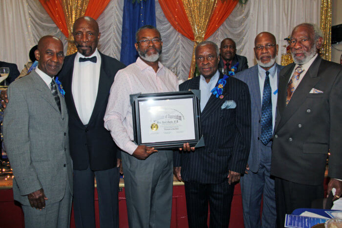 Karl Gayle, third from left, receives award.