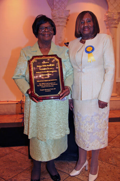 Elaine Mills-Forde receives award from Dr. Virginia Bernard.