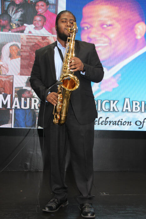 Michael Dundas, Jr. plays "Great is Thy Faithfulness" on the saxophone.