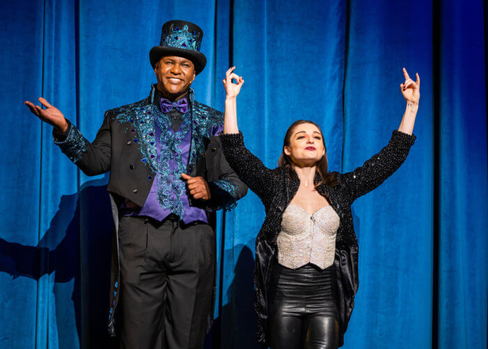 Ringmaster Johnathan Lee Iverson and Anna Gichan on stage. 
