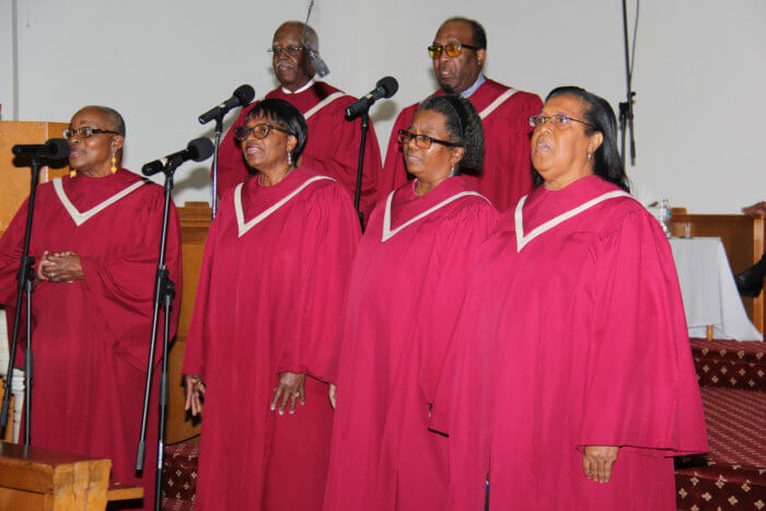 A section of St. Mark's United Methodist Chancel Choir renders "You Can't Beat God's Giving" and "Total Praise."