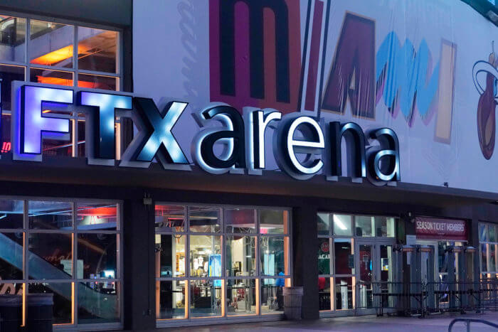  A sign for the FTX Arena, where the Miami Heat basketball team plays, is illuminated on Nov. 12, 2022, in Miami. FTX filed for bankruptcy protection Friday, Nov. 11. 