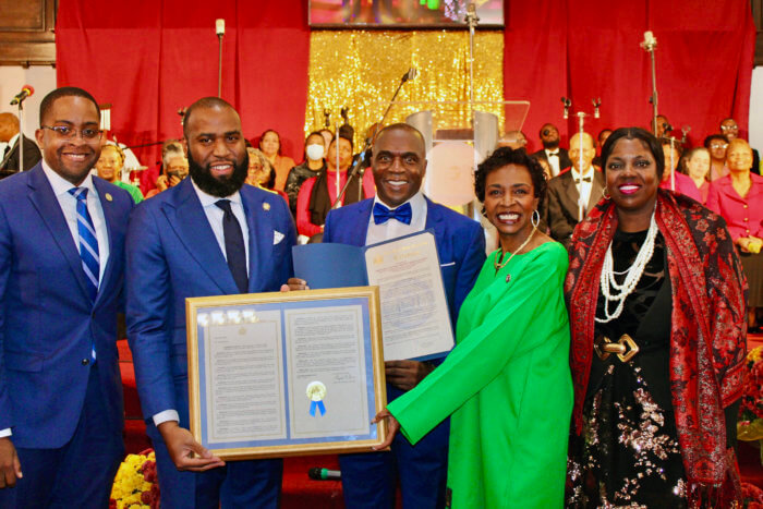 Elected officials, Senator Zellnor Myrie, Assemblymember Brian Cunningham, Reverend Dr. Clive E. Neil, Congresswoman Yvette D. Clarke and Charlene Gayle, of New York State Association of Black, Puerto Rican, Hispanic & Asian Legislators, (NYSABPRHAL), display resolutions passed in the NYS Assembly, and NYS Senate, in commemoration of the 170th Anniversary of Bedford Central Presbyterian Church, in Brooklyn.